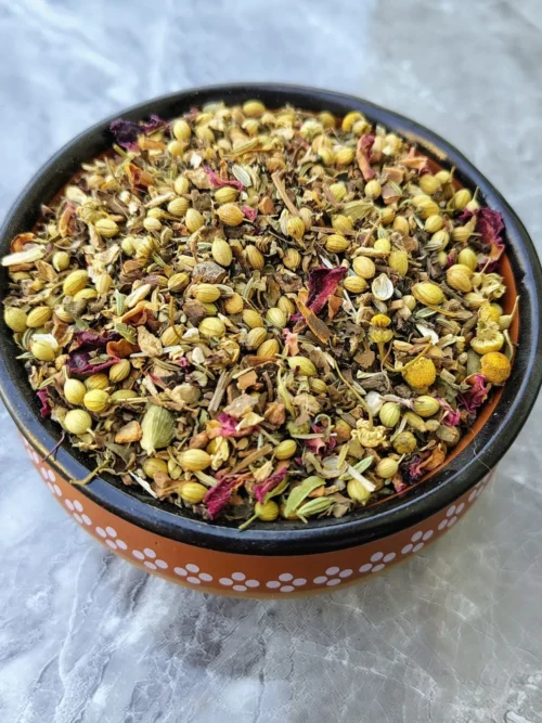 Actual picture of thyroid care tea pack and the tea ingredients in a bowl.